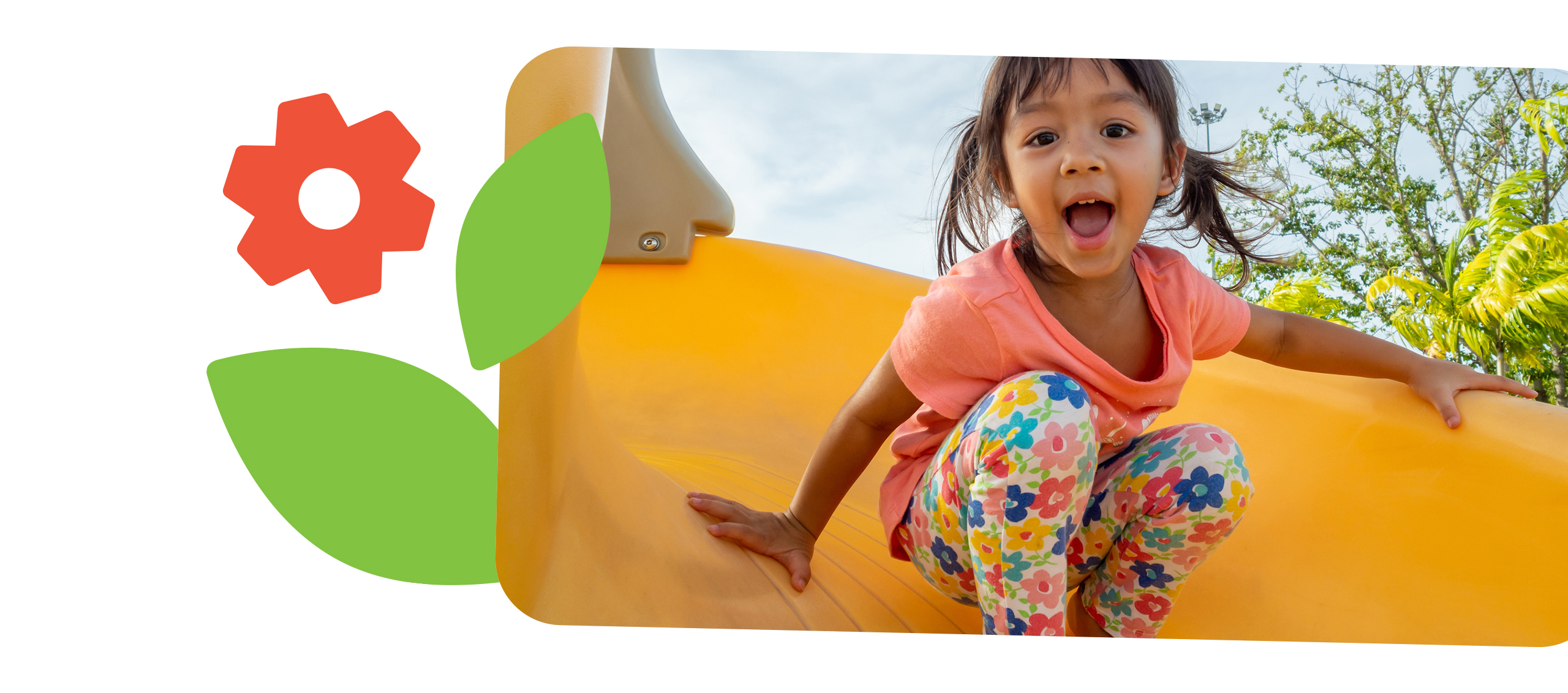 Young child playing on a slide.
